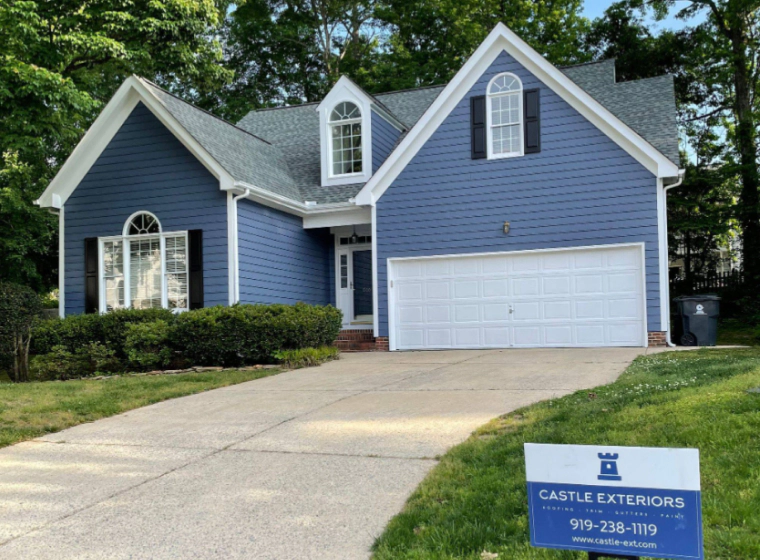 house with blue painted siding holly springs nc